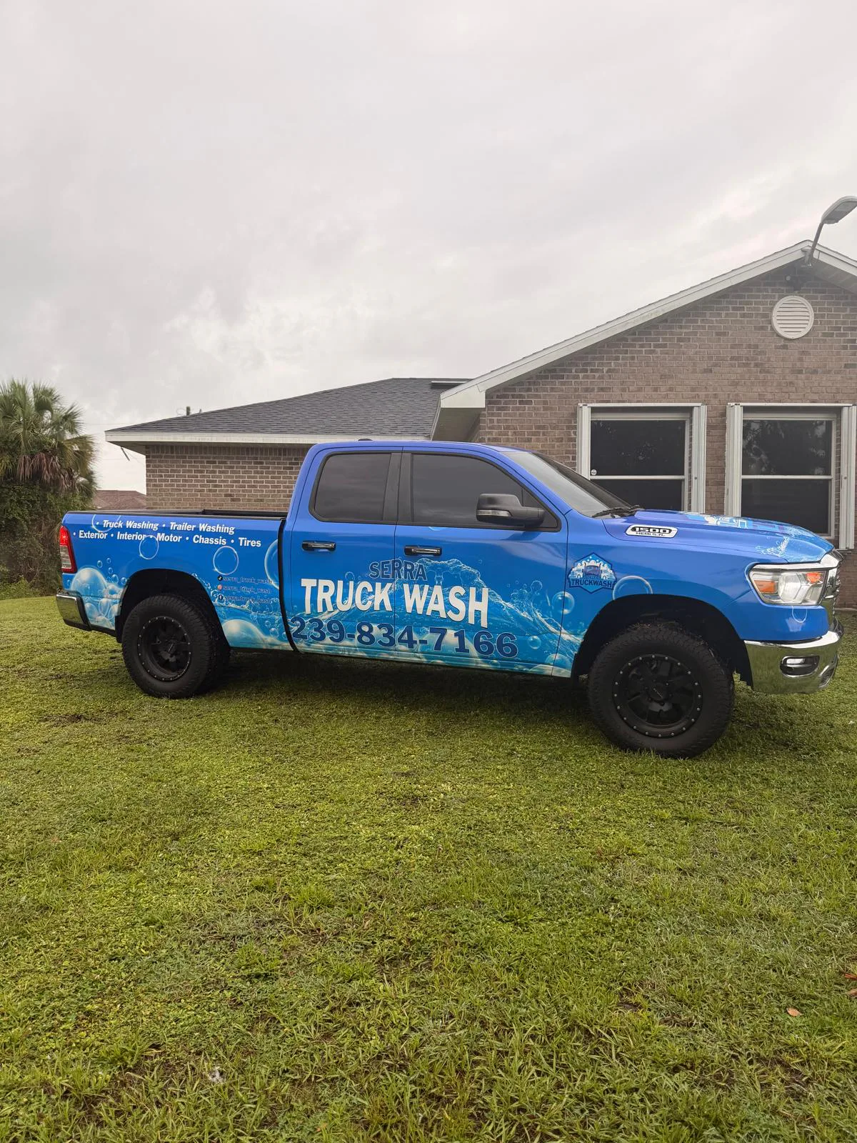 After: blue pickup truck completed with commercial truck-washing graphics.